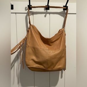 A real leather and tan colored Day and Mood purse with original dust bag.